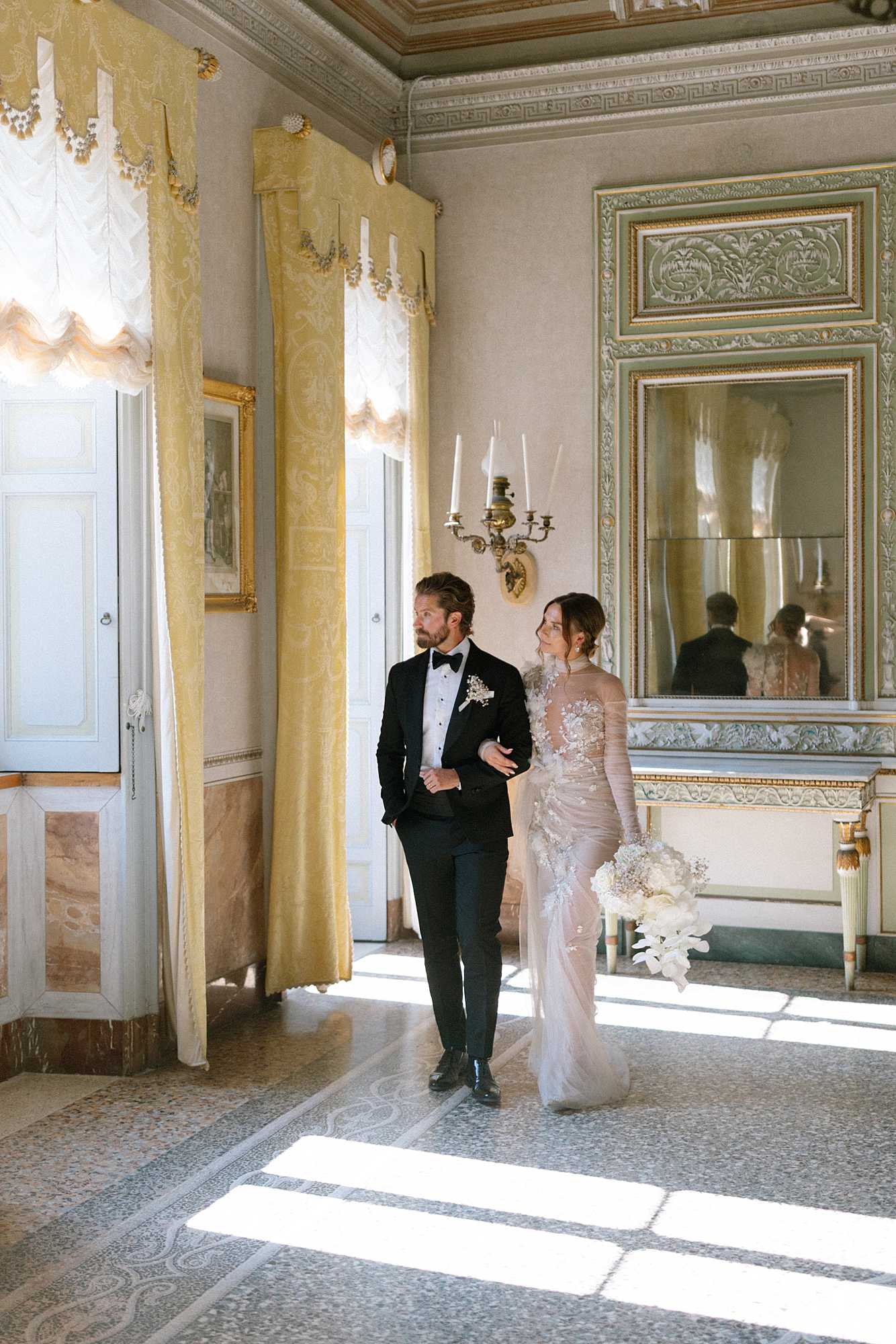 Bride and Groom walk inside Villa Pizzo during Lake Como wedding