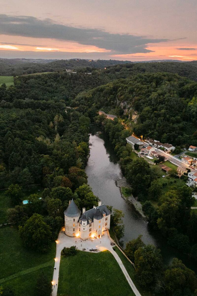 Drone view of Château de Saint Martory at sunset during a destination wedding in the French countryside.
