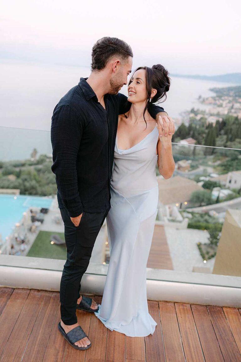 Couple embracing at a Corfu welcome party at Angsana Corfu Hotel overlooking the Ionian Sea