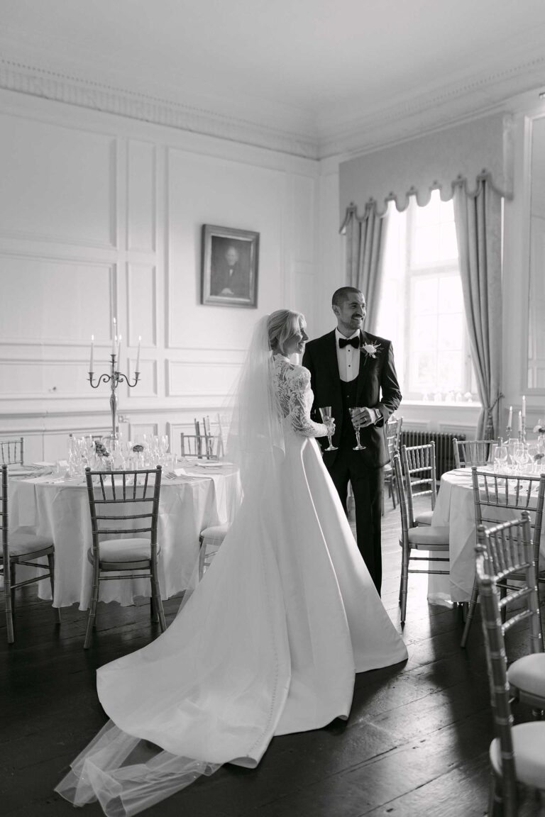 Bride and groom sharing a quiet moment inside Brympton House during their wedding